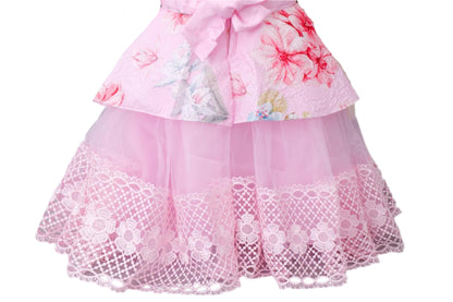 Pink floral dress with lace details on a gray background