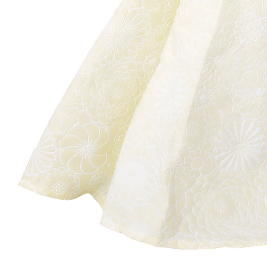 Close-up of textured white fabric on a gray background